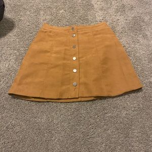 Orange-tan button up skirt.